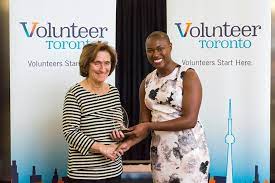 Two woman shaking hands