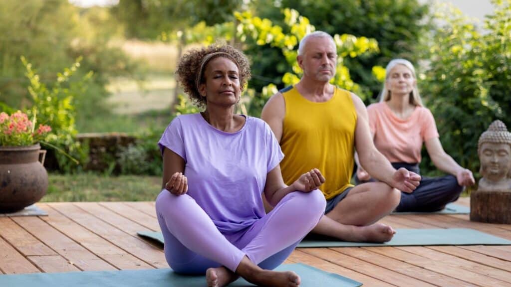 Three people doing yoga