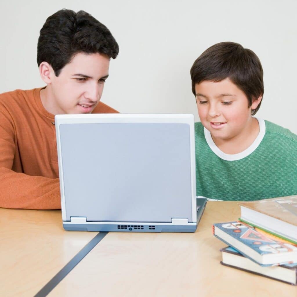 Two people on a laptop