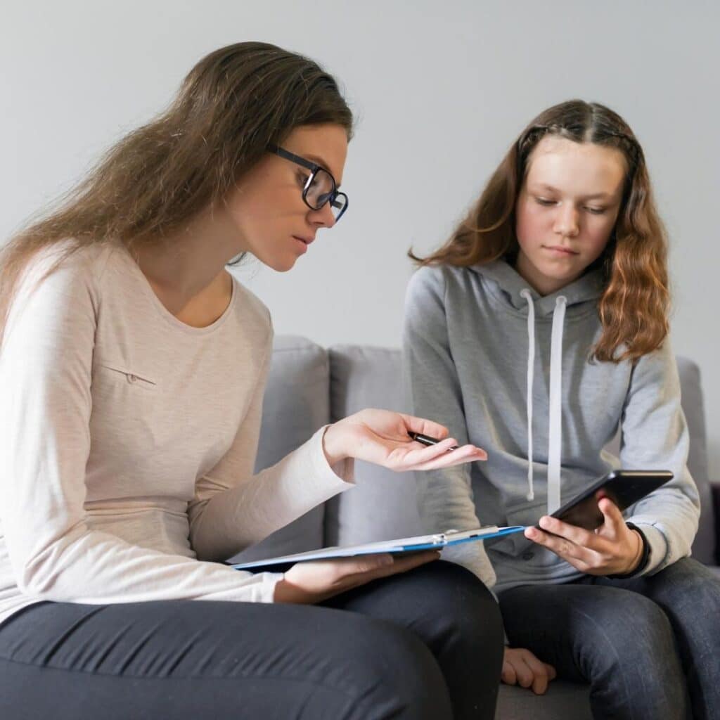 Two women looking at an ipad