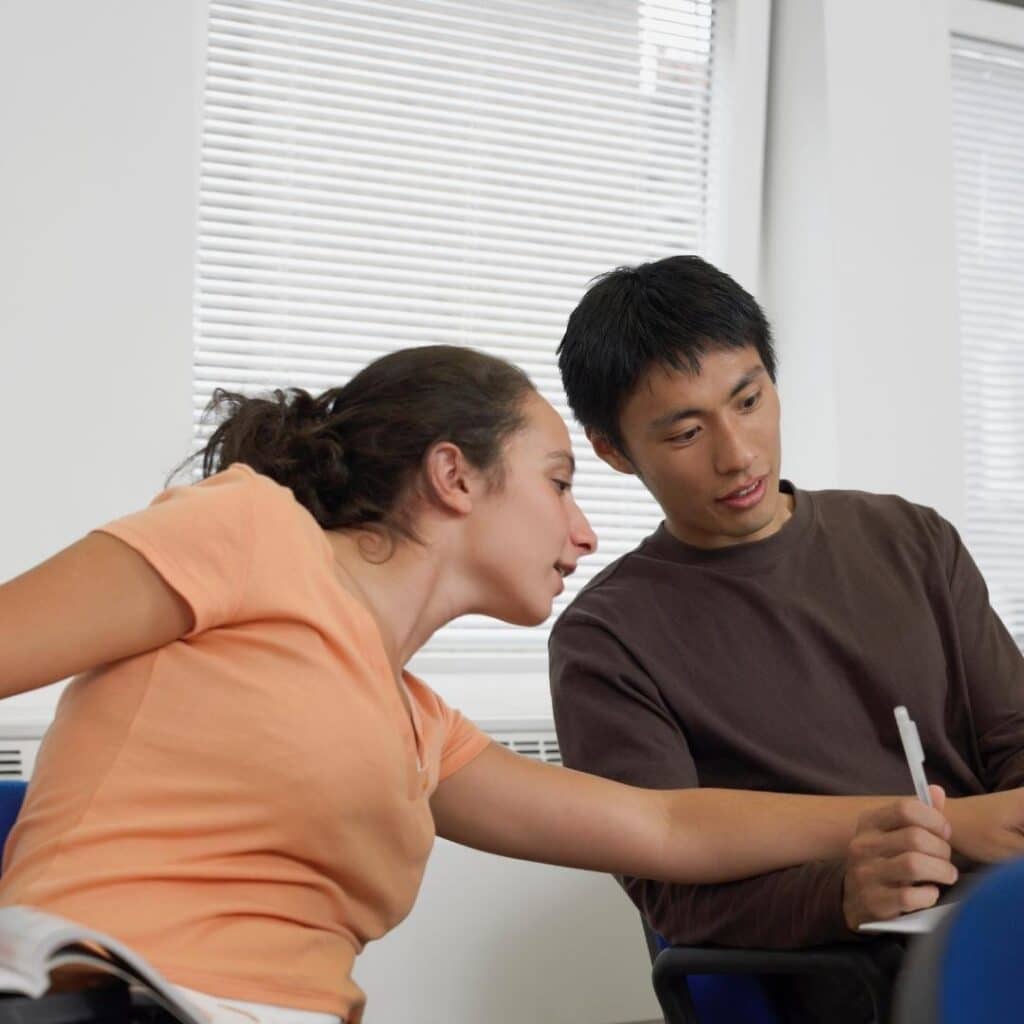 Two people discussing details